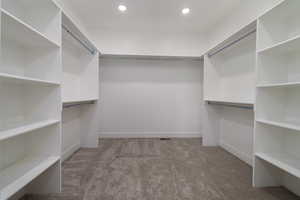 Spacious closet featuring carpet floors