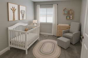Bedroom featuring a crib, carpet floors, and baseboards (virtual staging)