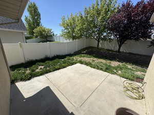 View of patio with a fenced backyard