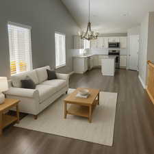 Living area featuring baseboards, dark wood-style flooring, a chandelier, and recessed lighting (virtual staging)