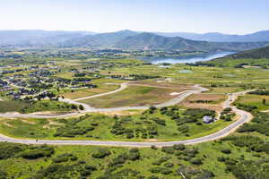 Bird's eye view featuring a water and mountain view