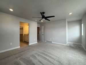 Unfurnished bedroom featuring recessed lighting, baseboards, a textured ceiling, visible vents, and light carpet