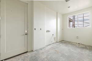 Empty room featuring concrete floors