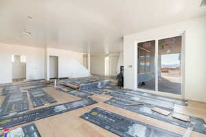 Interior space with arched walkways and wood finished floors