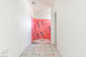 Hallway with tile patterned floors