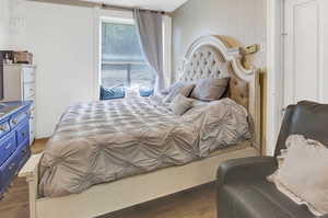 Bedroom with wood finished floors