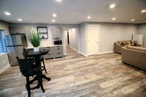 Interior space featuring light wood-type flooring, baseboards, and recessed lighting