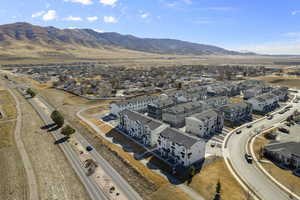 Birds eye view of property featuring a residential view and a mountain view