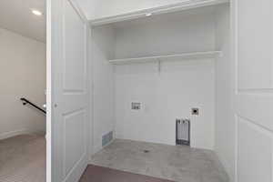 Laundry area with visible vents, hookup for a washing machine, baseboards, laundry area, and electric dryer hookup
