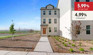 View of front facade featuring a rural view, a mountain view, and stucco siding