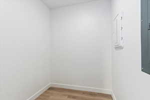 Empty room featuring baseboards and light wood-style floors