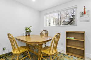 Dining room featuring wood finished floors and baseboards