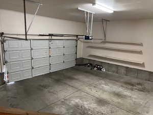 Garage featuring a garage door opener