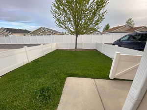 View of yard featuring a fenced backyard and a residential view