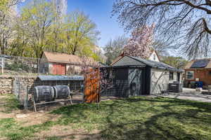 View of poultry coop featuring a yard and fence