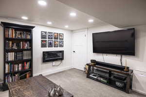 Living area featuring visible vents, baseboards, recessed lighting, and carpet