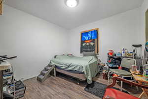 Bedroom featuring wood finished floors