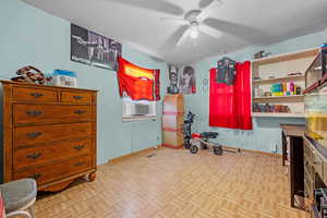Bedroom with baseboards and ceiling fan