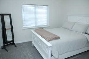 Carpeted bedroom with baseboards