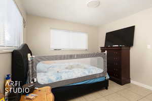 Primary bedroom with baseboards