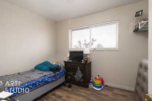 Bedroom #1 featuring baseboards and wood finished floors
