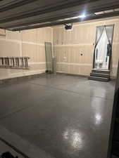 Garage featuring a garage door opener
