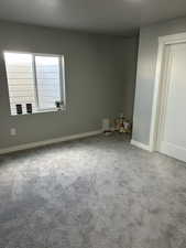 Carpeted spare room 4 featuring baseboards