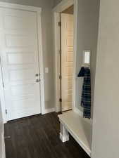 Mudroom with baseboards and dark wood finished floors