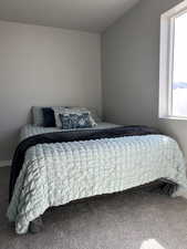 Carpeted bedroom with window