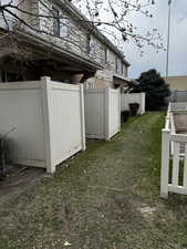 View of yard featuring fence