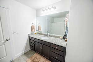Bathroom with baseboards and vanity