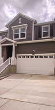 View of front of property featuring driveway and a garage