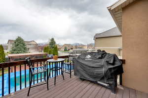 Deck with grilling area and a pool