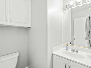 Bathroom featuring toilet and vanity