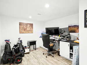 Home office featuring visible vents, recessed lighting, and light wood-type flooring
