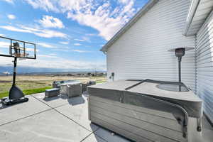 View of patio / terrace featuring a hot tub