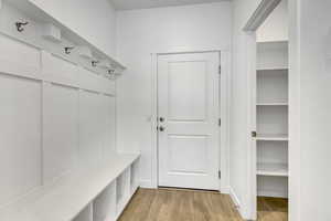 Mudroom with light wood-style floors