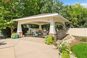 View of patio / terrace with a fenced backyard and a gazebo