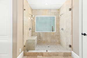 Full bath featuring a shower stall