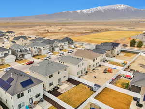 Drone / aerial view featuring a mountain view and a residential view