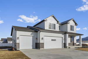 View of front of house featuring 3 car garage