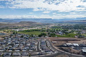 Aerial view of residential area featuring mountains
