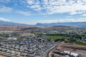 Aerial perspective of suburban area with a mountainous background