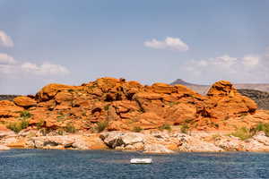 View of mountain backdrop with a large body of water