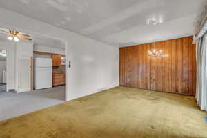 Original carpet with view into kitchen