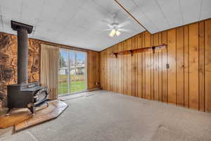 Wood burning stove with sliding door to backyard