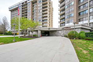 View of building exterior with covered drop off porte cochere