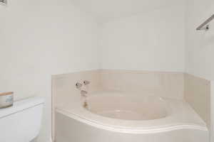Bathroom with a bath and toilet