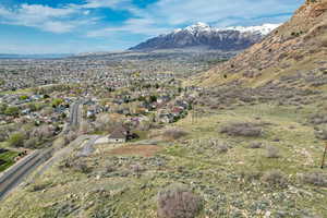 Property view of mountains with a residential view