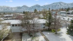 Property view of mountains with a residential view
